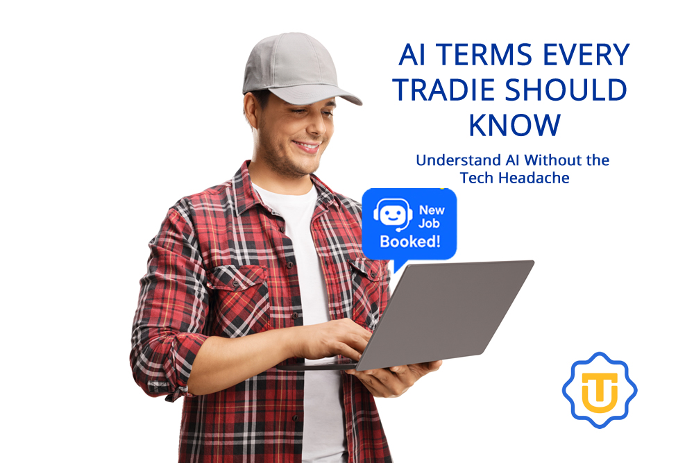 AI Terms Every Tradie Should Know A man in a plaid shirt and cap smiles while using a laptop. On the right, text reads AI Terms Every Tradie Should Know and Understand AI Without the Tech Headache. A New Job Booked! pop-up and logo are also visible.